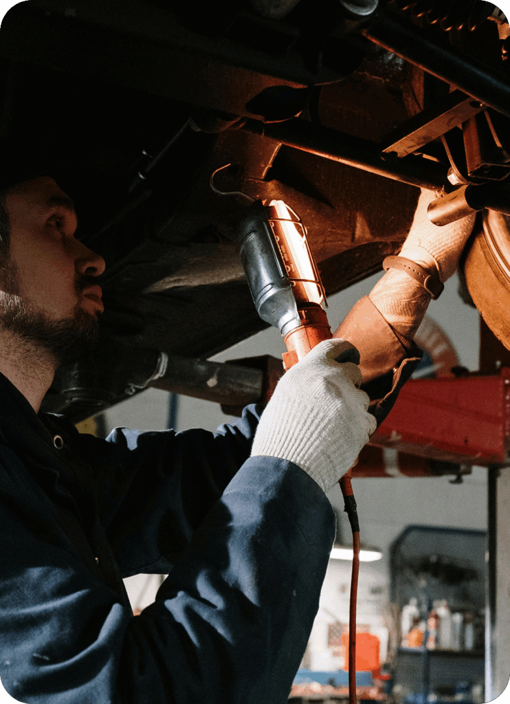 It’s like having a bookkeeper and a financial advisor. Man under car making repairs with a light.